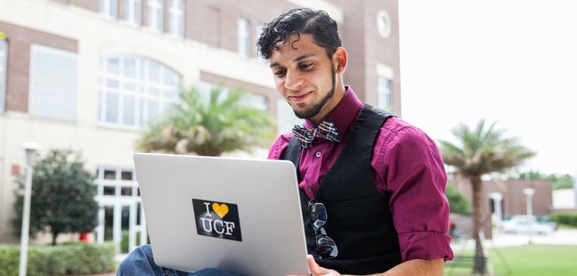 Male student studies outside of Classroom II