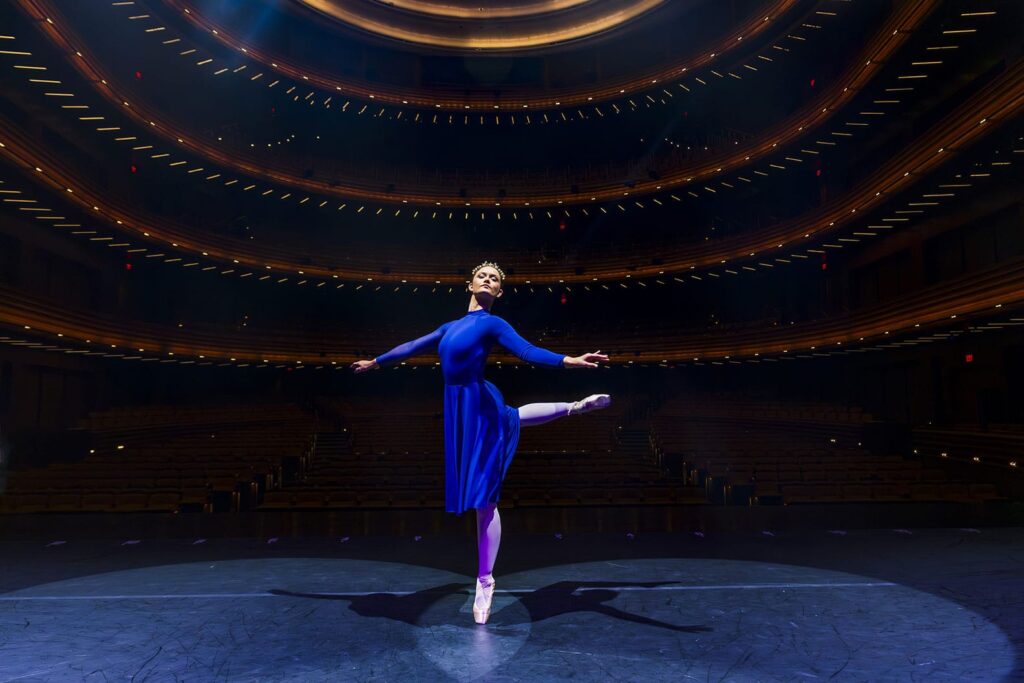 A dancer holds an arabesque during rehearsal for UCF Celebrates the Arts at Dr. Phillips Center for the Performing Arts in Downtown Orlando.