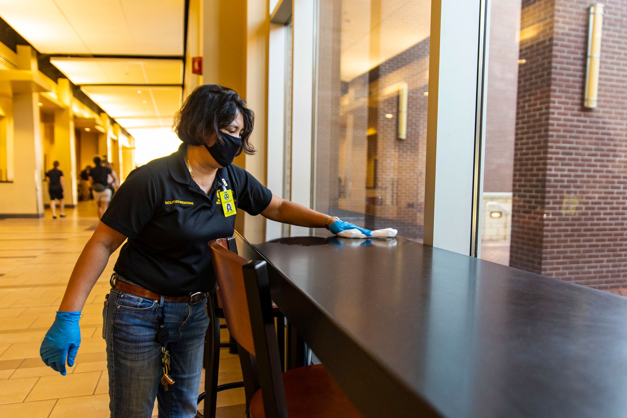 photo of housekeeping staff cleaning countertop