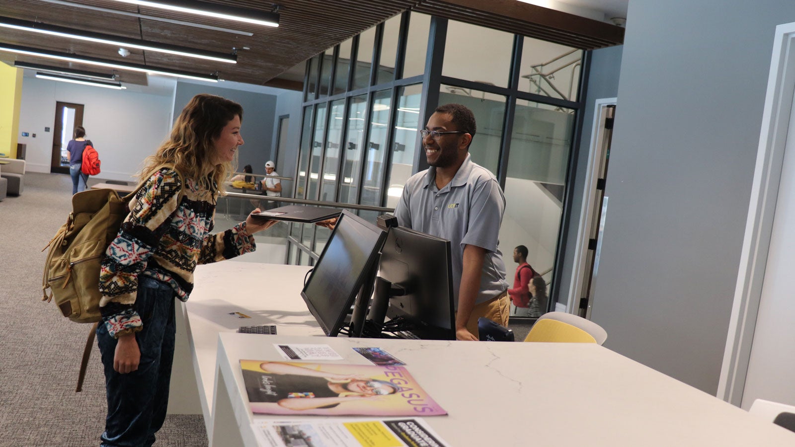 employee and student at I T desk