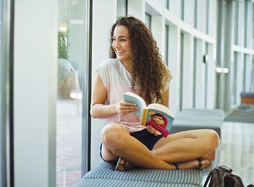 A student looks out the window. 