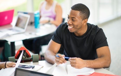 Student sitting at table working