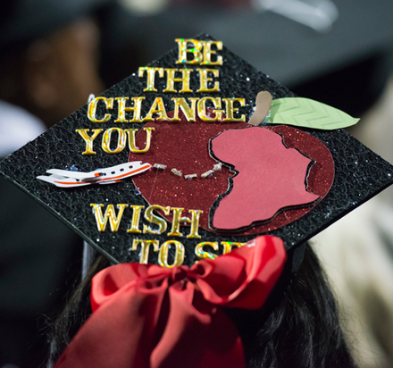 Graduation cap with words Be the change you wish to see