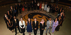 A photo of the student Founders Day recipients standing around the UCF seal.