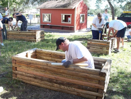 Volunteers work at the UCF Creative School.