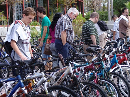 Prospective buyers looking at bikes.