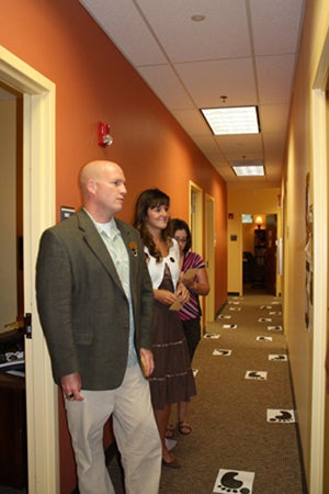 Counseling Center guests tour the halls and stop to read clinicians bios posted on their doors.