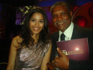 Professor Major poses with Freida Pinto, of Slumdog Millionaire fame, at the 2009 Directors Guild of America Awards.