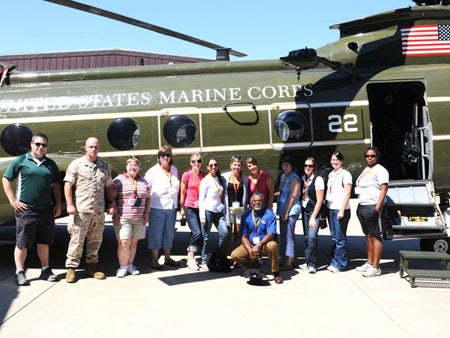 Workshop participants wait to board their helicopter.