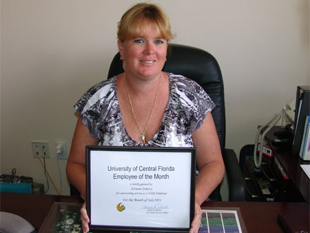 Adrianne “DeeDee” Demetry with certificate