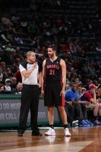 Referee Steve Anderson discusses a call with Greivis Vasquez of the Toronto Raptors. (Courtesy of NBA)