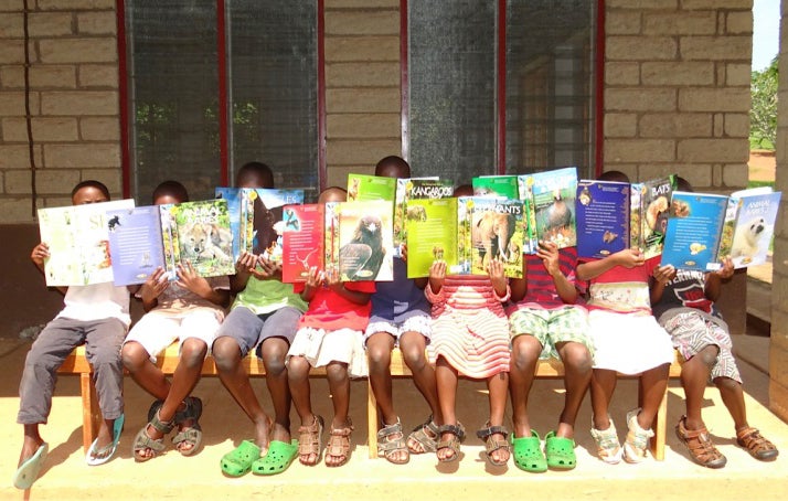 Rafiki primary students in Uganda enjoying library timeEDIT