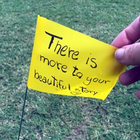 Students wrote inspirational messages of hope on the flags at Memory Mall.