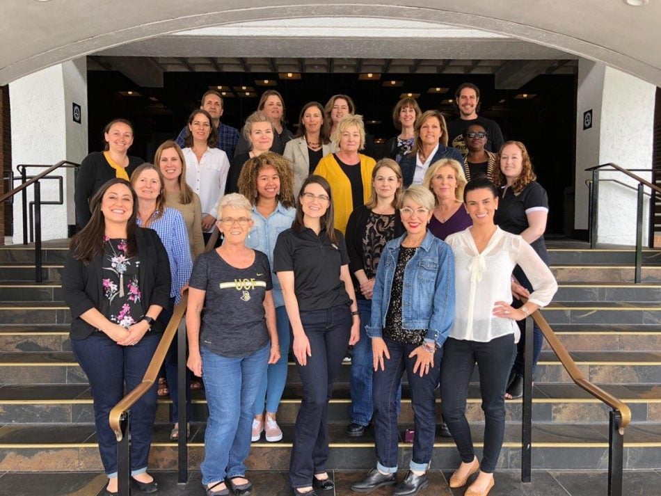 group of ucf staff From Victim Services on steps