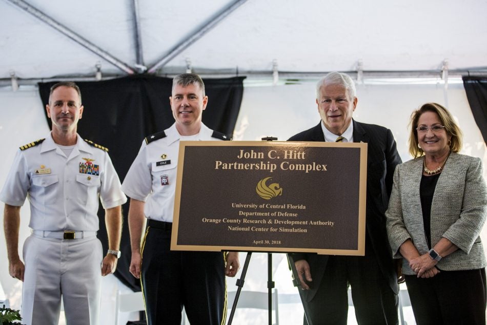 The four major institutions supporting the Hitt Dedication Complex are UCF, the Department of Defense, Orange County Research & Development Authority, and the National Center for Simulation. “John Hitt has created a powerful, strategic partnership that not only catapults UCF but catapults our entire region,” says Orange County Mayor Teresa Jacobs, who is pictured on the right. (Also pictured: Capt. Erik Etz, commanding officer, Naval Air Warfare Center Training Systems Division and Brigadier Gen. William Cole, program executive officer for Simulation, Training & Instrumentation)
