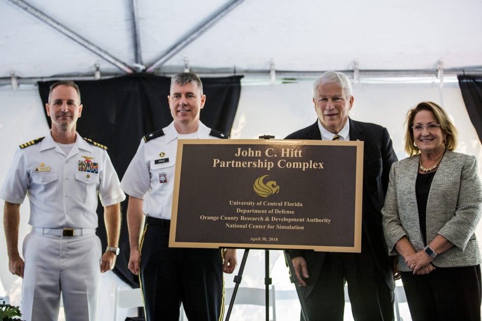 The four major institutions supporting the Hitt Dedication Complex are UCF, the Department of Defense, Orange County Research &amp; Development Authority, and the National Center for Simulation. “John Hitt has created a powerful, strategic partnership that not only catapults UCF but catapults our entire region,” says Orange County Mayor Teresa Jacobs, who is pictured on the right. (Also pictured: Capt. Erik Etz, commanding officer, Naval Air Warfare Center Training Systems Division and Brigadier Gen. William Cole, program executive officer for Simulation, Training &amp; Instrumentation)