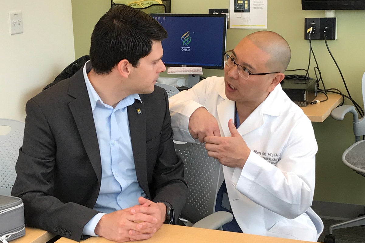 Albert Manero, co-founder and CEO of Limbitless Solutions, and Albert Chi discuss the clinical trial at OSHU’s campus in Portland.
