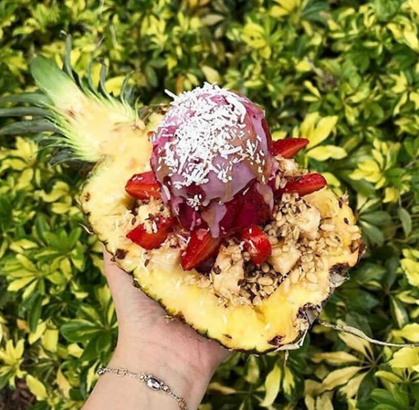 Jobos Acai Bowl — made with banana, strawberries, coconut flakes and Nutella, topped with honey or agave