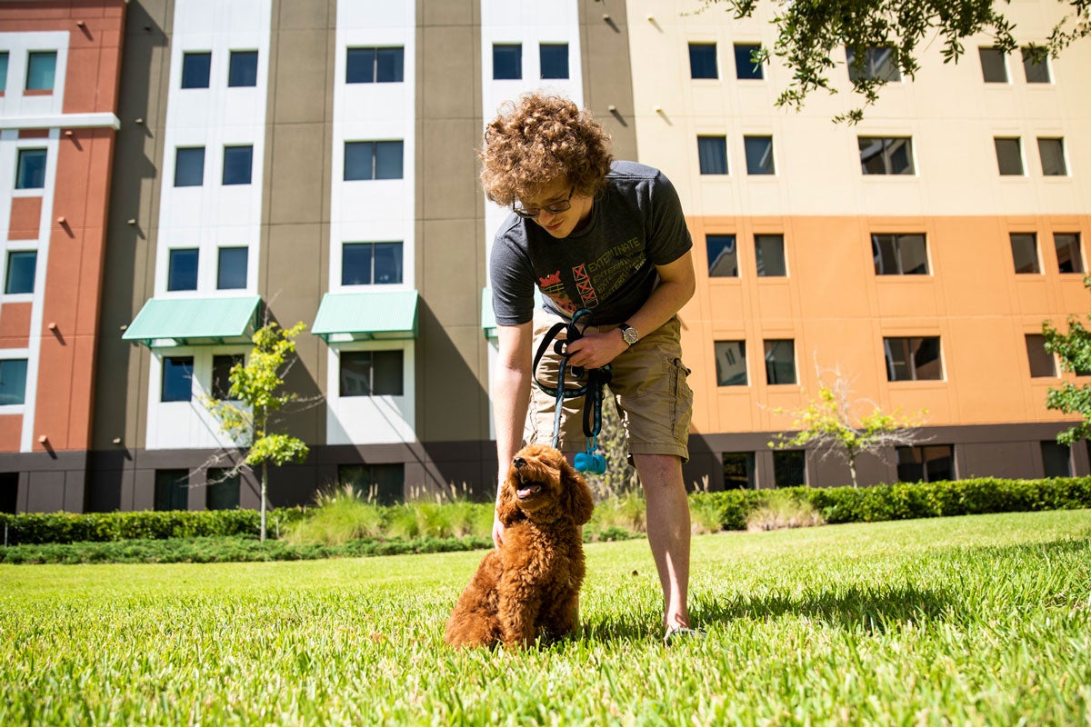 photo of UCF student and his dog