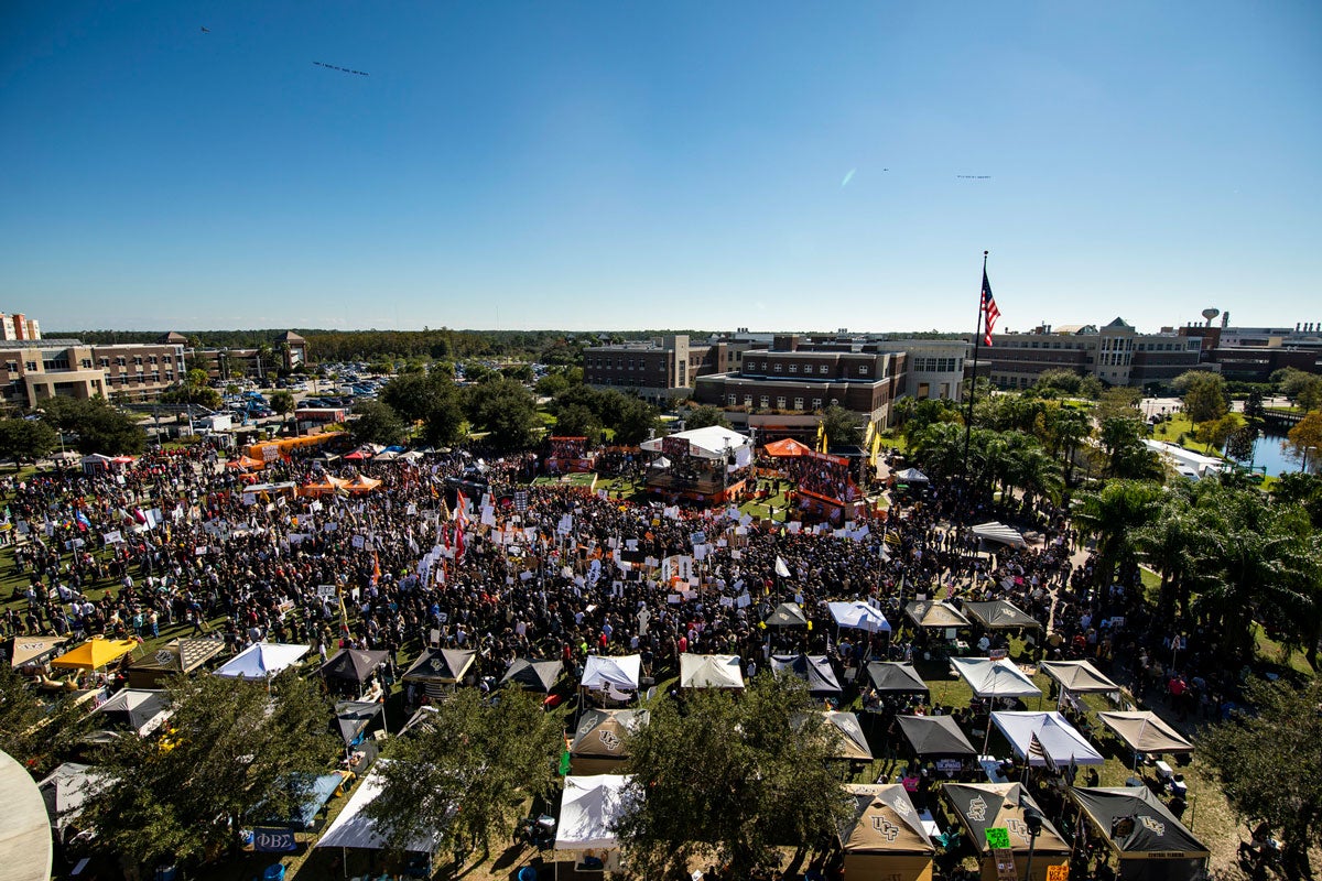 wide shot of crowd around College GameDay set on Memory Mall on blue, cloudless day