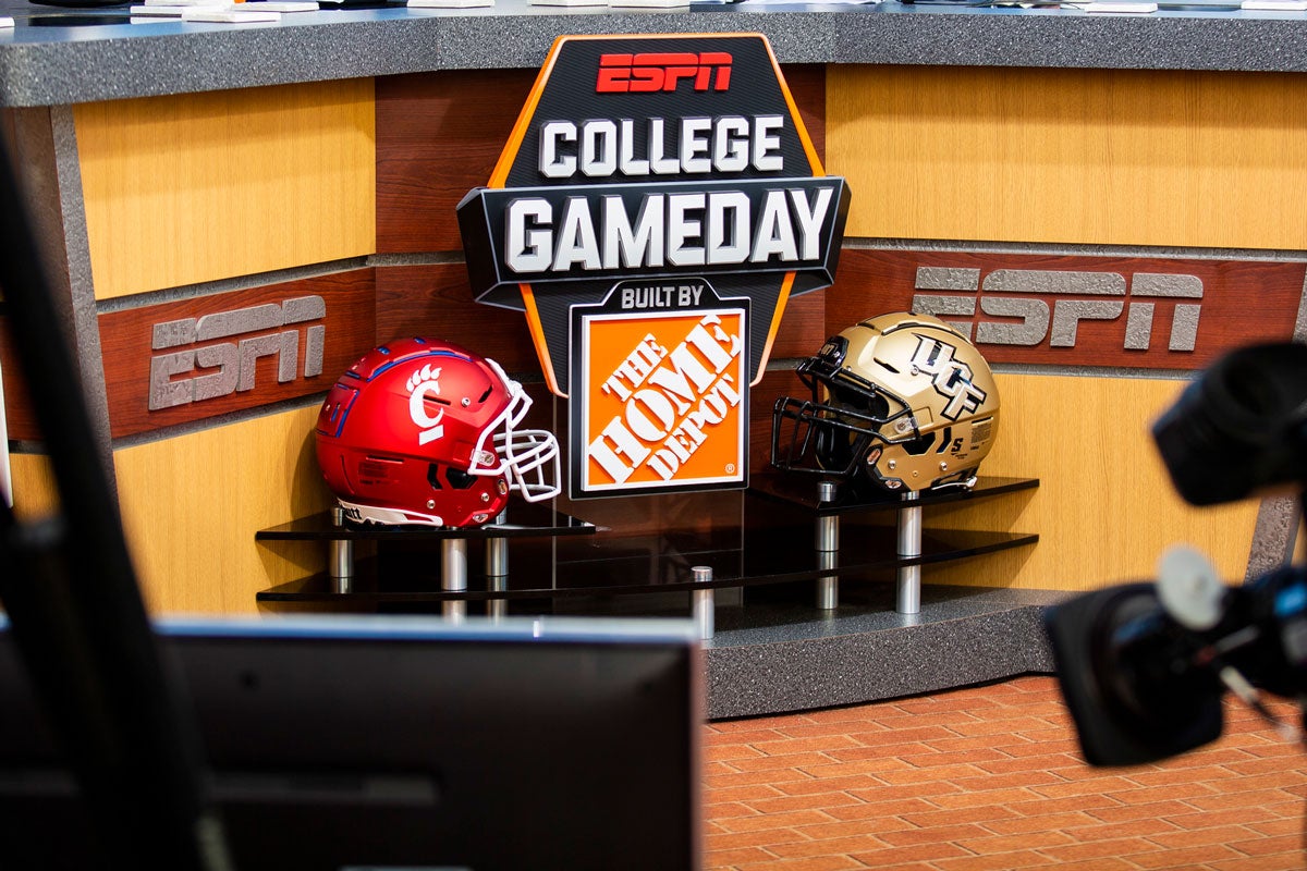 College GameDay desk and UCF and Cincinnati helmets