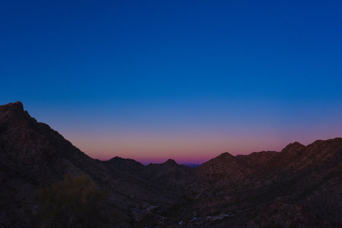 Jeweled tone sky with dusty mountains