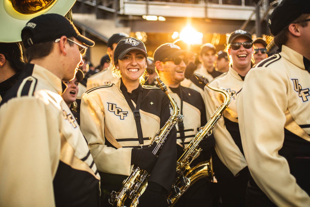 The Marching Knights get ready to perform on the football field during half-time at the game against Florida Atlantic University.