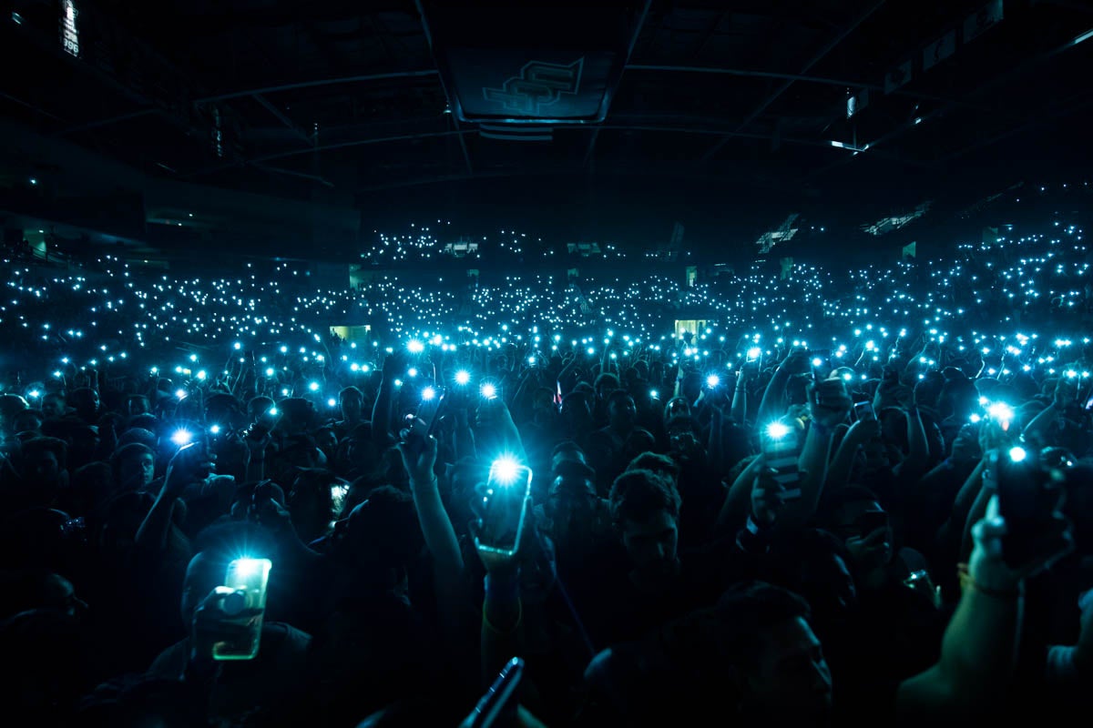 Students light up CFE Arena during Homecoming 2018's Concert Knight, which featured performances from rapper A$AP Ferg and singer Ella Mai.