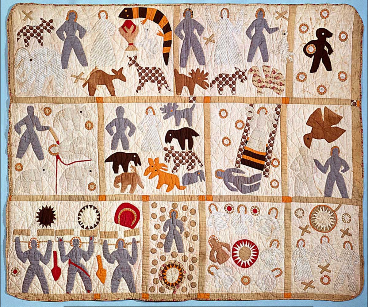 Tan quilt with panels of stitched figures acting out bible scenes