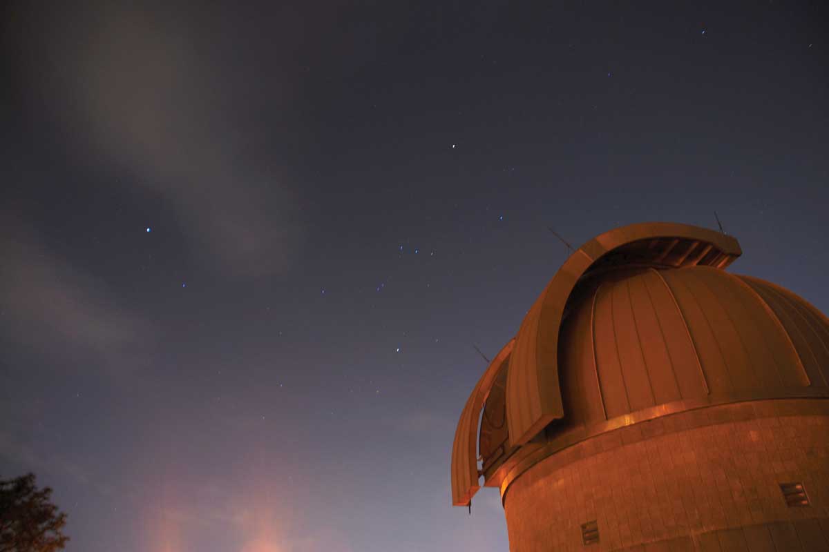 Observatory dome under night sky