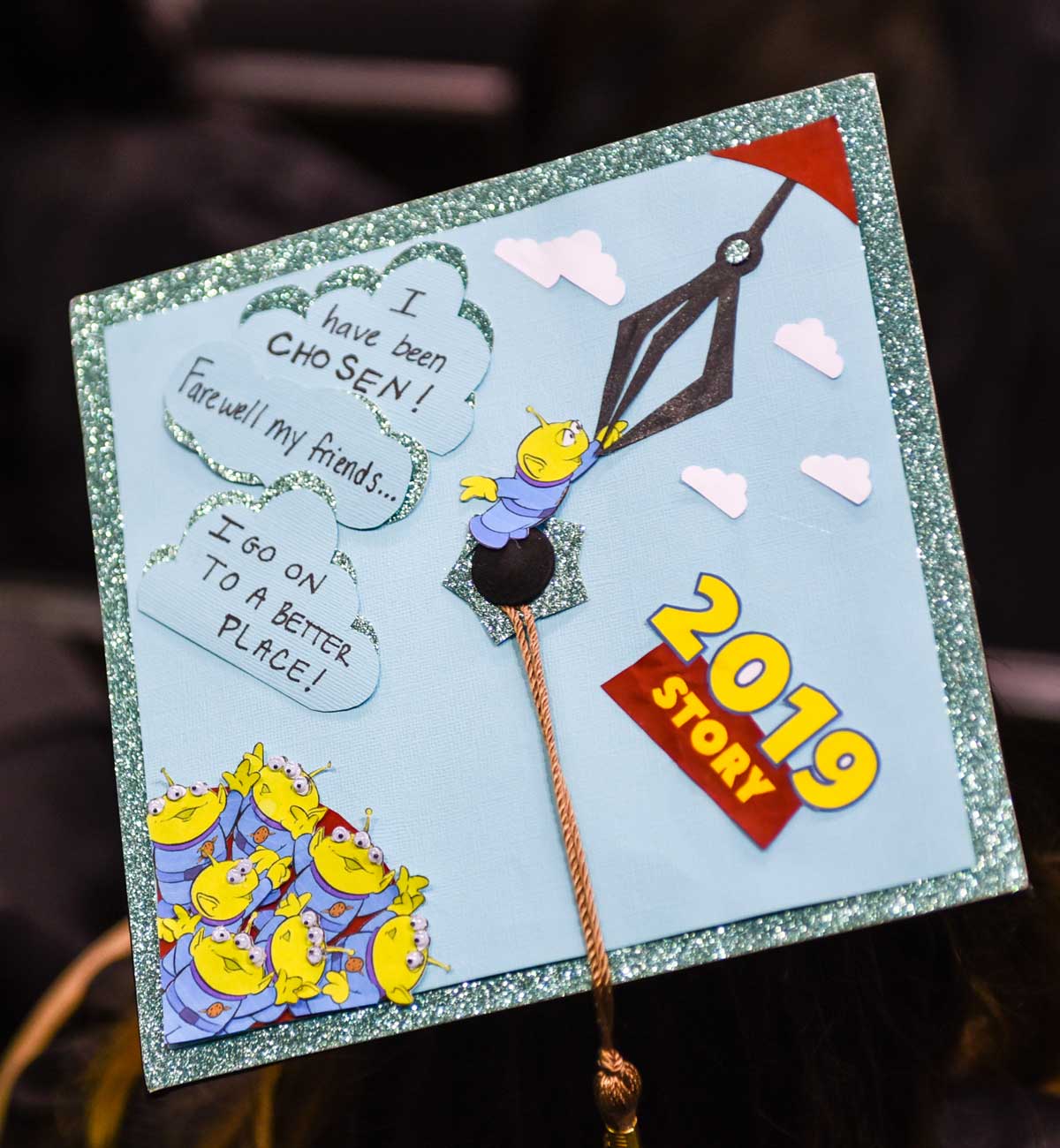 Grad cap decorated with Toy Story aliens 