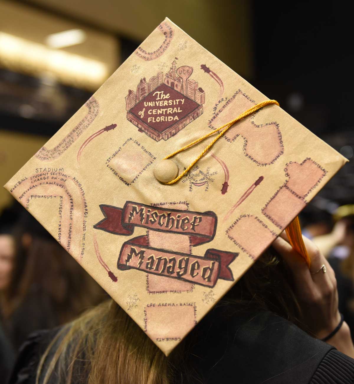 Grad cap decorated with Harry Potter's Marauders Map