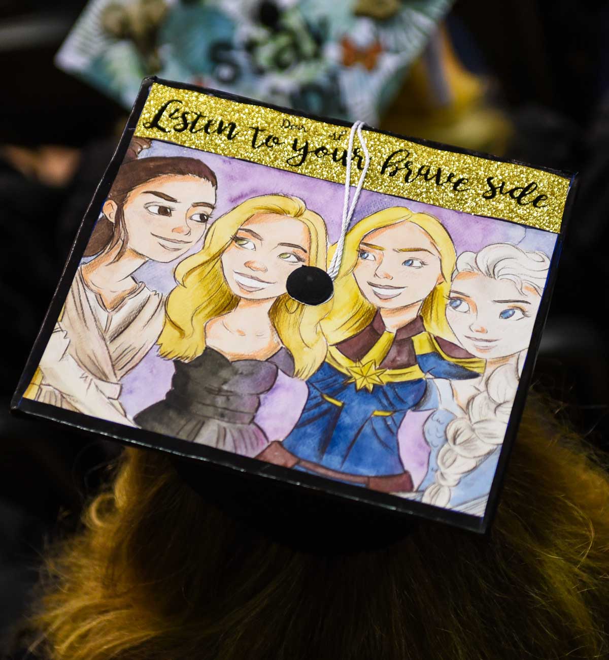 Grad cap decorated with Disney princesses