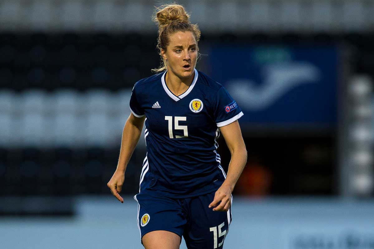 Female soccer player in blue #15 jersey