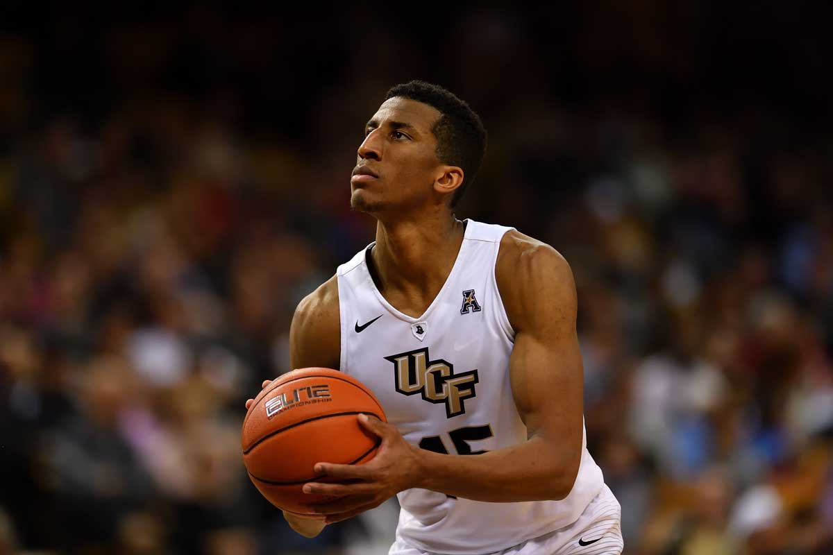 basketball player Aubrey Dawkins sets to shoot ball