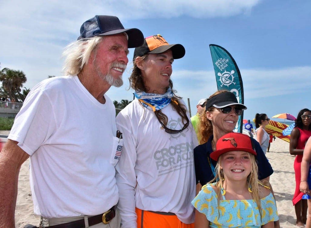 The Suit family: Travis with daughter Piper, father, Bob, and sister, Leann.