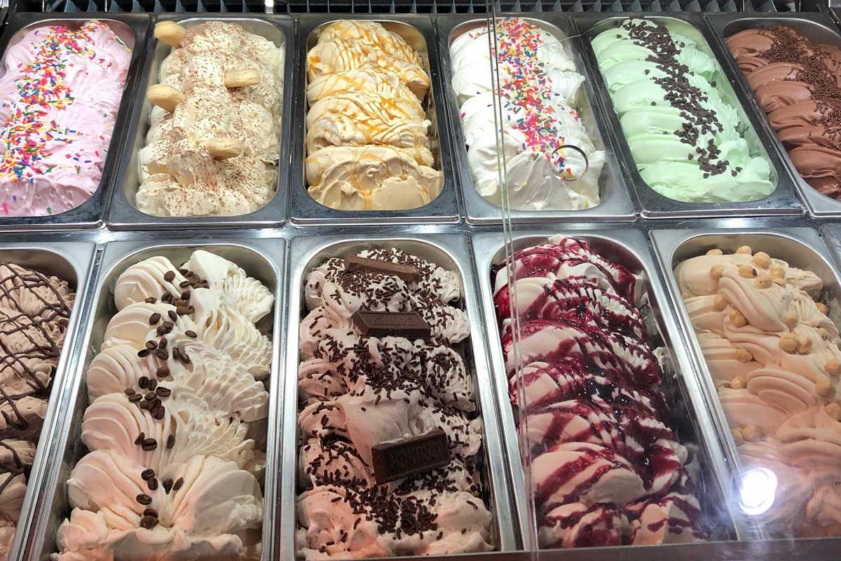 two rows of gelato in metal bins