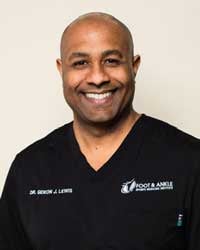 African-American man in black medical scrubs