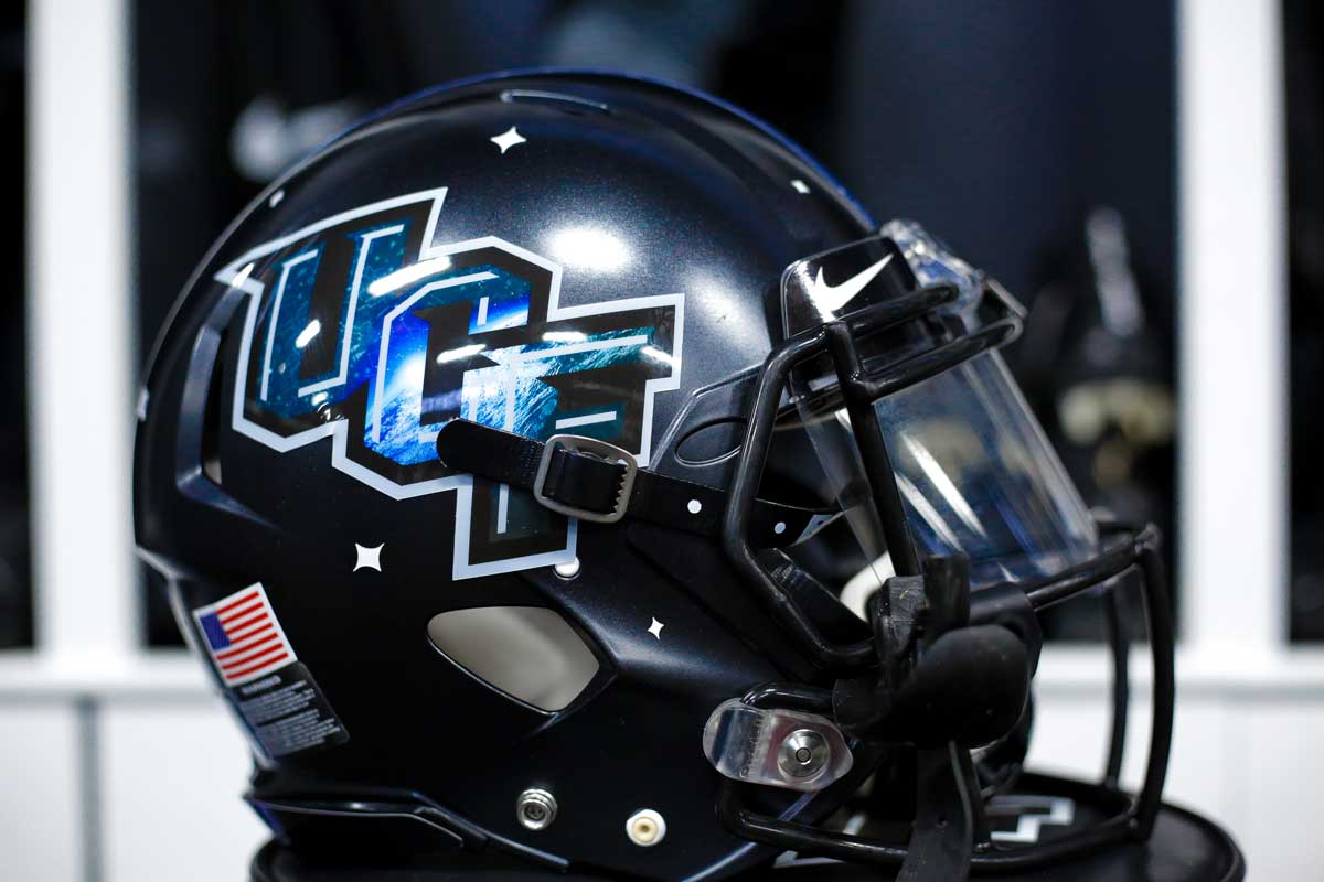 black football helmet with moon-design embedded in UCF logo