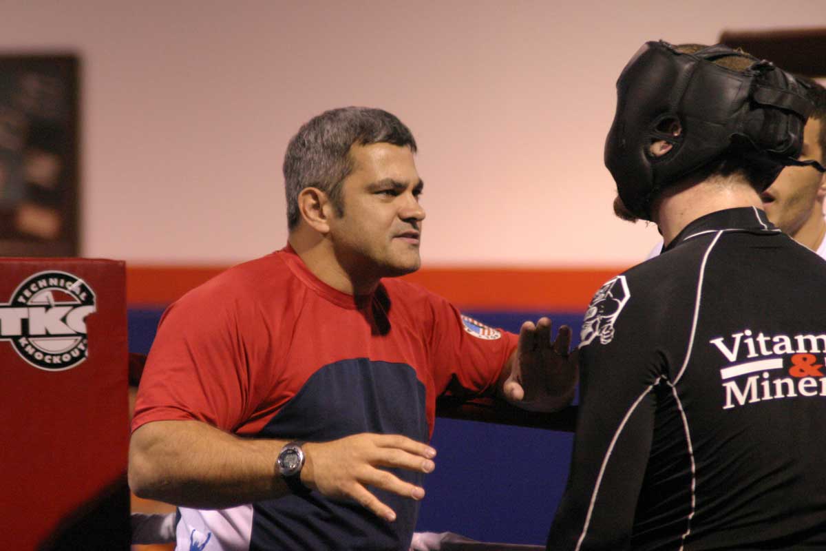 Ricardo Liborio coaches man in black headgear