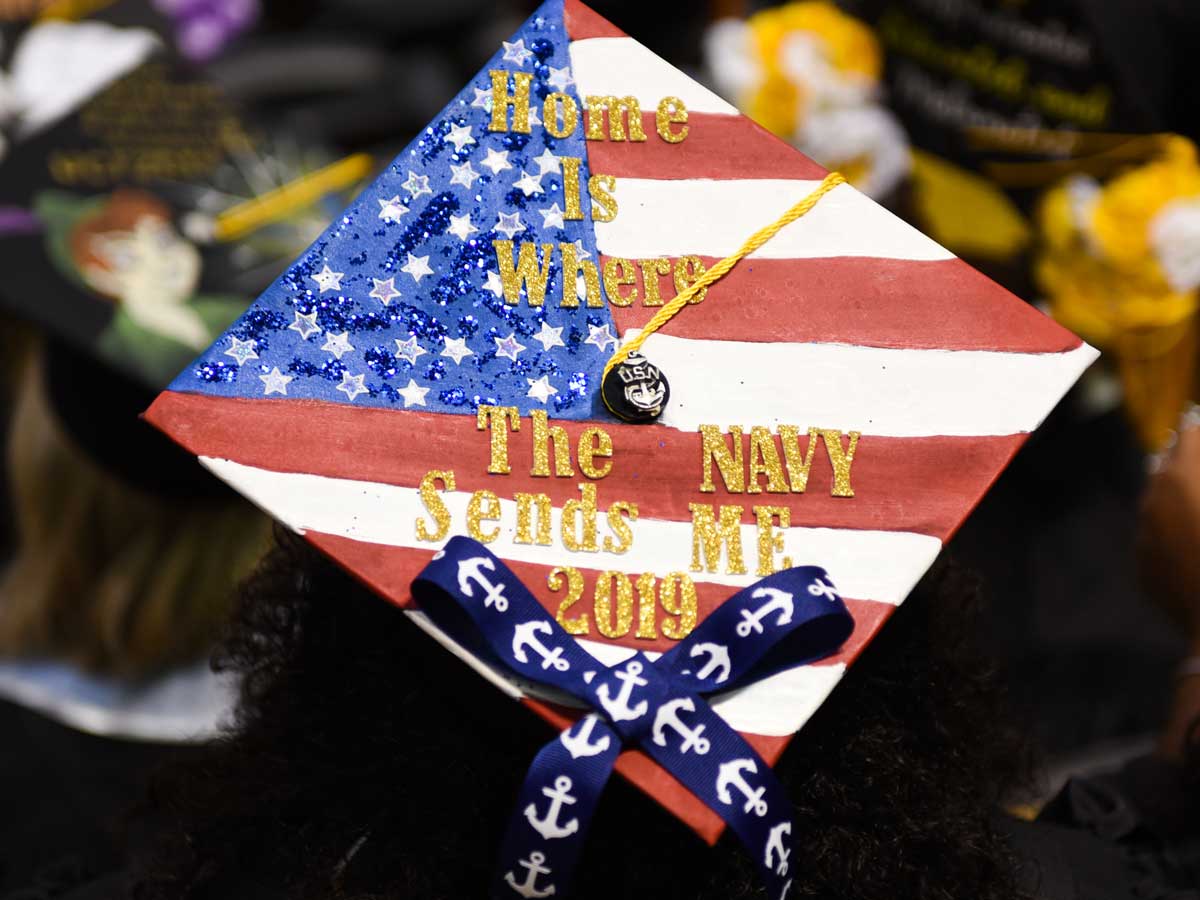 Decorated grad cap: Home is where the Navy sends me