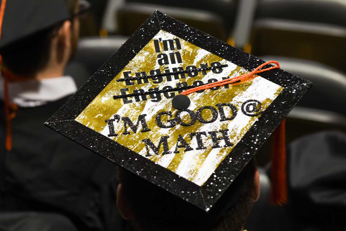 Decorated Grad Cap: I'm an [two crossed out mispellings of engineer] I'm good @ math