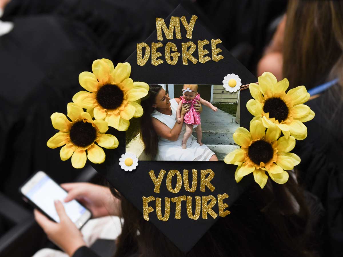 decorated grad cap: My degree, your future with photo of mom and baby daughter