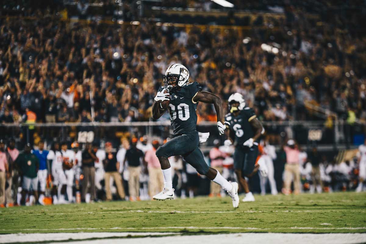 UCF running back Greg McCrae sprints toward the end zone