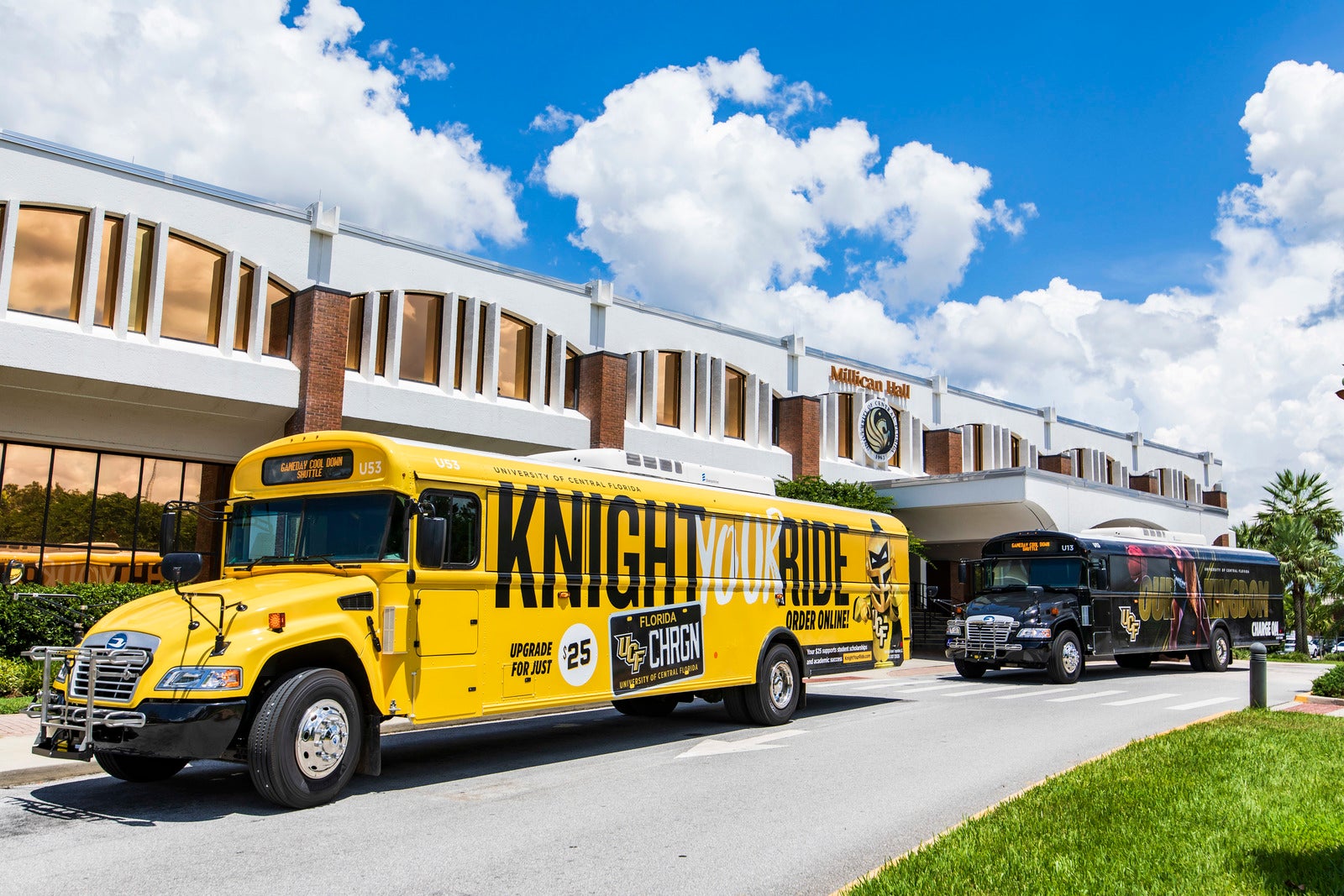 UCF Shuttle bus in front of Millican Hall with writing on the side that says Knight Your Ride