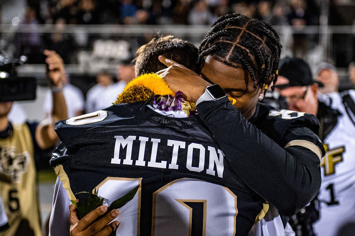 McKenzie Milton embraces Brandon Moore