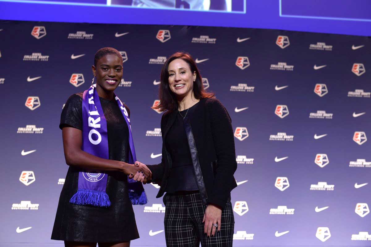 Konya Plummer shakes hands with Kate Markgraf