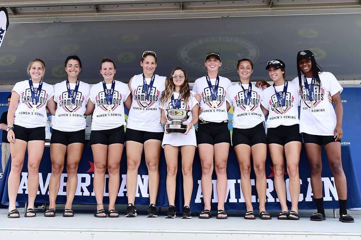 UCF rowing team links arms and holds trophy at conference championship