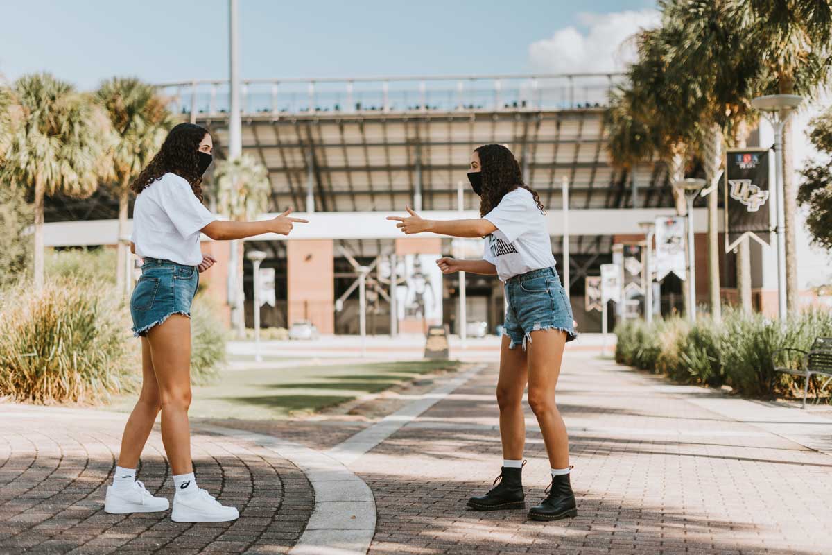 Twins reenact the popular Spider Man Gif, pointing at each other 