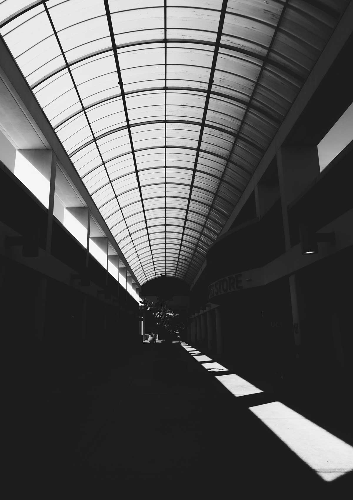 black and white photo of empty UCF breezeway